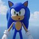 Sonic stands in front of a large ocean with his mouth open.